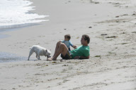 Matthew Mcconaughey having a sweet time with his son and his dog on Malibu beach 

