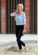 SHARON STONE with messy hair and without make up playing with her sons at Coldwater Canyon Park
