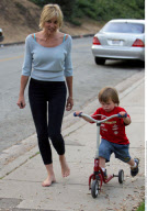 SHARON STONE with messy hair and without make up playing with her sons at Coldwater Canyon Park