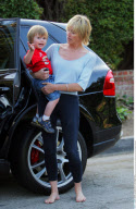 SHARON STONE with messy hair and without make up playing with her sons at Coldwater Canyon Park