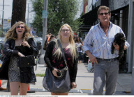 Actor DAVID HASSELHOFF with his daughters HAYLEY and TAYLOR ANN posing for the paparazzi