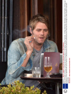 Brian McFadden drinking, smoking and watching videos on his laptop, Sydney, Australia - 24 May 2009