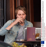 Brian McFadden drinking, smoking and watching videos on his laptop, Sydney, Australia - 24 May 2009
