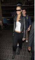 Singer RIHANNA with a huge fancy hair bump arriving on a BA flight from London at LAX airport