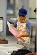 Heiress PARIS HILTON has to take off her $890 Louboutins at the LAX airport