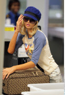 Heiress PARIS HILTON has to take off her $890 Louboutins at the LAX airport