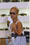 Actress JESSICA ALBA with scabs on her neck spotted shopping for new sunglasses in Los Angeles
