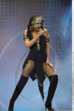 Sexy KYLIE MINOGUE dons a glittering mask and a hot bodysuit as she performed in Madrid
