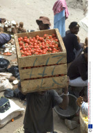 Vendors carrying unusual goods for sale on their heads, Ghana, West Africa  - Mar 2007