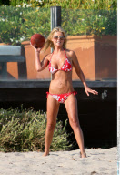 TARA REID showing off her destroyed tummy after too much liposuction