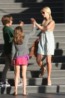 High fives all around for Paris Hilton