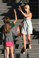 High fives all around for Paris Hilton