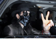 Grey hair? 50-year-old MICHAEL JACKSON exits a medical building in Beverly Hills
