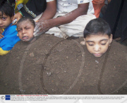 Paralysed children Buried for Solar Eclipse Cure, Gulbarga, India - 22 Jul 2009