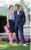 Actor ED WESTWICK with pink bow tie and a Dom Perignon bottle filming 'Gossip Girl' in New York