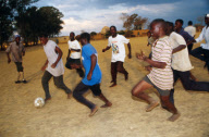 Farm workers forget the insecurity of their position in a game of soccer