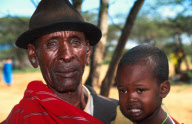 Koliaas Longonyek with a child who may be his grandson or even son. Longonyek is the elder in charge of peace among the warriors in his area, Lkisin