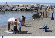 Body of a drowned man lying on a beach at Mappatella, Naples, Italy - 31 Jul 2009