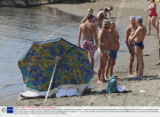 Body of a drowned man lying on a beach at Mappatella, Naples, Italy - 31 Jul 2009