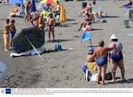 Body of a drowned man lying on a beach at Mappatella, Naples, Italy - 31 Jul 2009