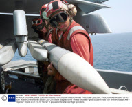 AVIATION ORDNANCEMEN LOADING MISSILE FOR OPERATION ENDURING FREEDOM, USS CARL VINSON, ARABIAN SEA - 09 OCT 2001