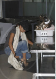 Actress EVA LONGORIA PARKER going to at a security check point at LAX airport