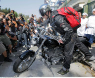 Cool JUSTIN TIMBERLAKE was surrounded by paparazzi as he jumped on his Harley