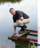 Ducklings fished from drain by fisherman, Colyford, Devon, Britain - 12 Aug 2009