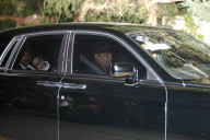 Paris Jackson leans on her grandmother's shoulder as they drive to her father's funeral