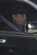 Paris Jackson leans on her grandmother's shoulder as they drive to her father's funeral