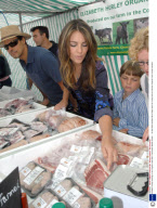 Elizabeth Hurley working on her Organic meat stall, Cirencester Market, Britain  - 12 Sep 2009