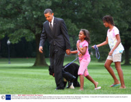 US President Barack Obama is welcomed by daughters Sasha and Malia on the South Lawn of the White House, Washington DC, America - 15 Sep 2009