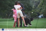 US President Barack Obama is welcomed by daughters Sasha and Malia on the South Lawn of the White House, Washington DC, America - 15 Sep 2009