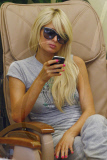 Heiress PARIS HILTON looking bored on her cell phone while getting a pedicure in Beverly Hills