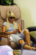 Heiress PARIS HILTON looking bored on her cell phone while getting a pedicure in Beverly Hills