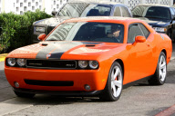 *EXCLUSIVE* Arnold Schwarzenegger shows off his classic Dodge Challenger SRT