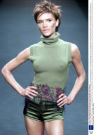 Posh Spice - Victoria Beckham At The Maria Grachvogel Fashion Show. Posh Spice Victoria (adams) Beckham On The Catwalk Modelling For Fashion Designer Maria Grachvogel Wearing Green Hot Pants And Sleeveless Top With Brown Boots... London Fashion Week.
