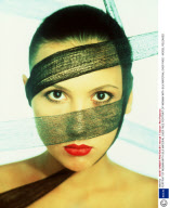 PORTRAIT OF WOMAN WITH SILK MATERIAL OVER FACE