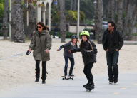 Actress KATE BECKINSALE with daughter, puppy and hubby out for a stroll on Santa Monica beach