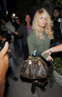 Singer JESSICA SIMPSON with fresh blow dried hair and splintered nail polish leaving the Ken Paves salon