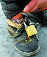 Father chains 2-year-old son by roadside while working to stop him being 'stolen', Liangxiang, Beijing, China - Feb 2010