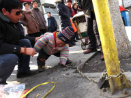 Father chains 2-year-old son by roadside while working to stop him being 'stolen', Liangxiang, Beijing, China - Feb 2010