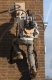'Human spiderman' Jem Stansfield scales 30ft wall using suction from two vacuum cleaners, Brighton, Britain - 14 Feb 2010