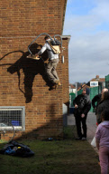 'Human spiderman' Jem Stansfield scales 30ft wall using suction from two vacuum cleaners, Brighton, Britain - 14 Feb 2010