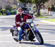 Billy Ray Cyrus Rides A Purple Hog With No Helmet