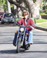 Billy Ray Cyrus Rides A Purple Hog With No Helmet