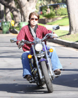 Billy Ray Cyrus Rides A Purple Hog With No Helmet