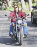 Billy Ray Cyrus Rides A Purple Hog With No Helmet