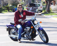 Billy Ray Cyrus Rides A Purple Hog With No Helmet