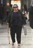 Kathy Bates Walks With A Cane Through LAX 